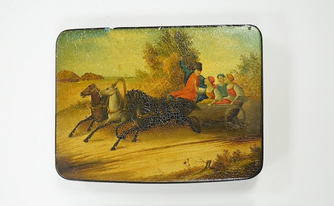 Four Russian lacquer boxes, late 19th/early 20th century, decorated with troika scenes, largest 12cm wide. Condition - fair